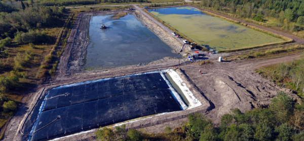 Banner image - sludge dewatering wastewater lagoon
